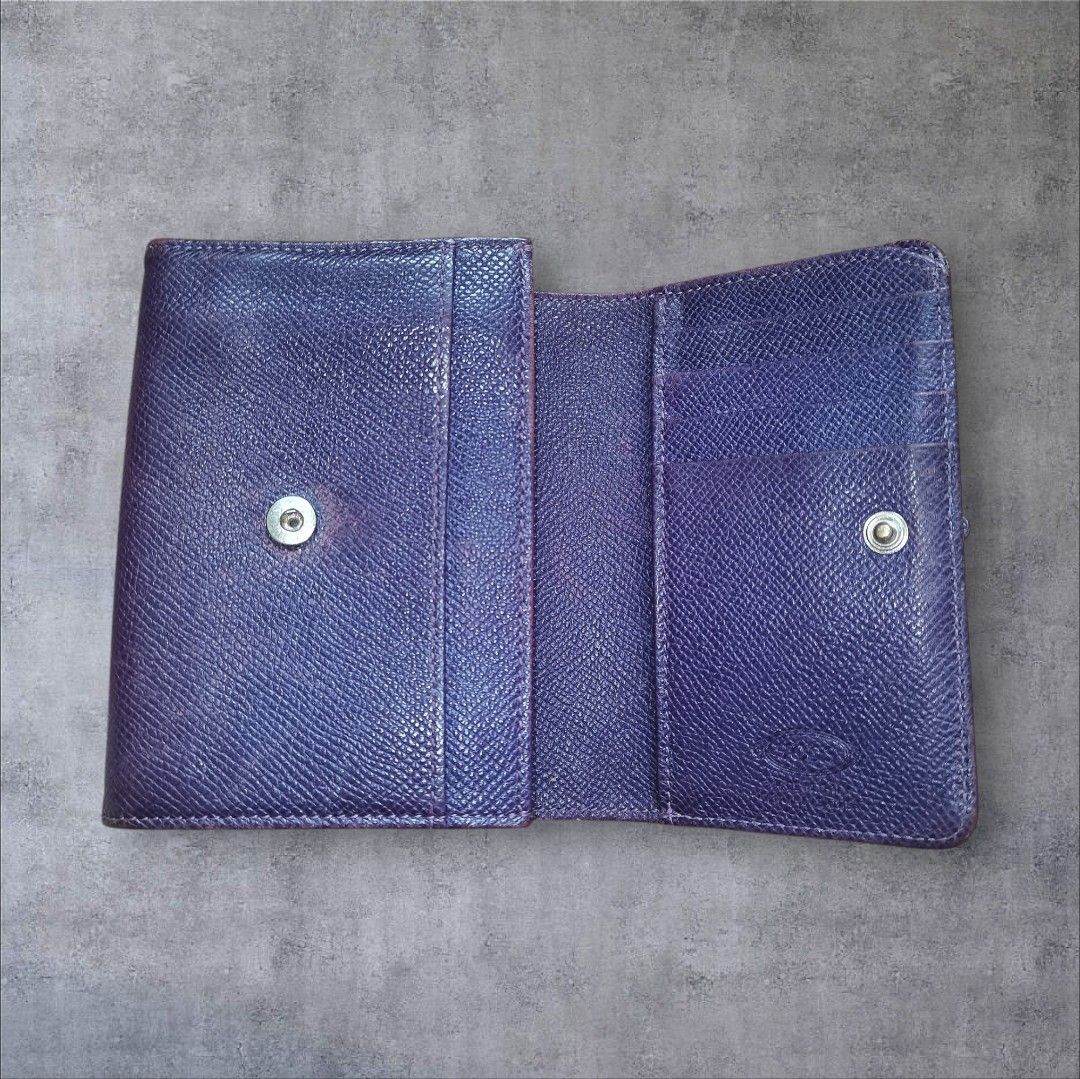 TOD'S Purple Textured Leather Tri-Fold Wallet (Category: Wallets & Card holders) located in Manila. Submitted by eagerbeaverph (Listing ID 1441862886, Image 3). Description: Tods wallet H 4 inches W 5 Signs of usage Rubs scratches creases Please see detailed pics Neg Dm.
