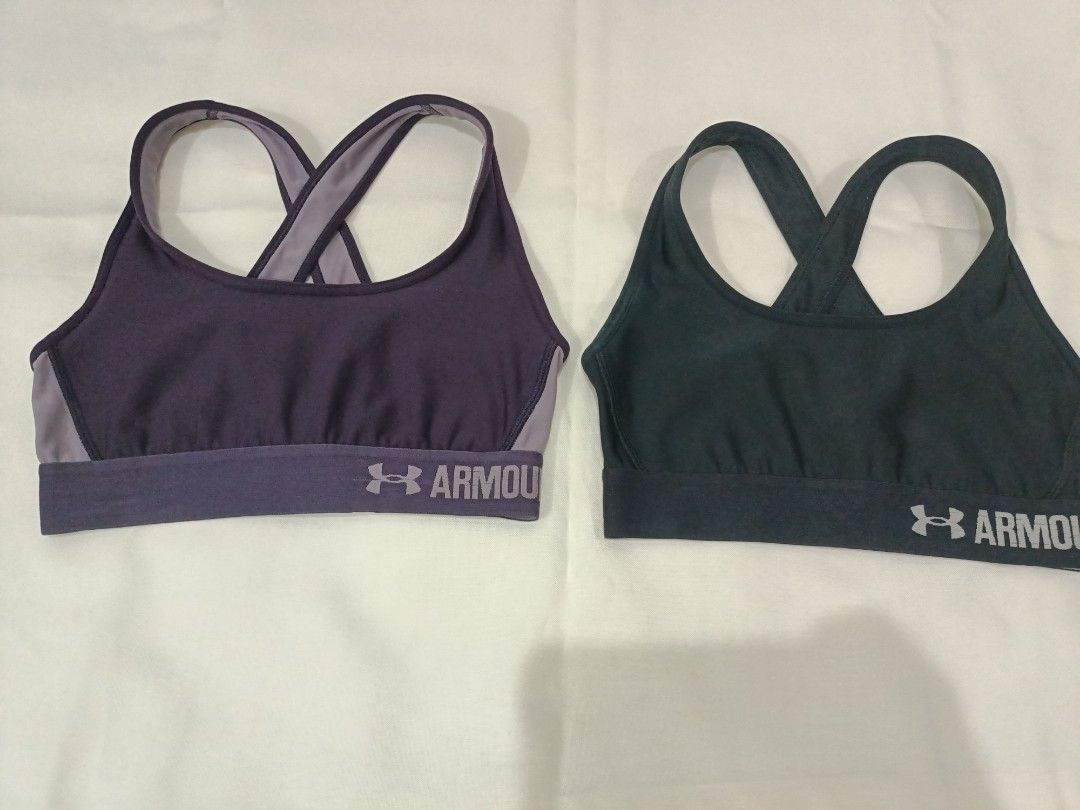Under Armour Sports Bras (2 pcs) (Category: Activewear) located in Las Pinas. Submitted by tsc.cst (Listing ID 1441870432, Image 1). Description: - Two Under Armour sports bras included. - Colors: Deep purple with lighter purple trim/straps, and dark grey/black with grey trim/straps. - Features Under Armour logo on the band. - Designed with a comfortable cross-back strap style. - Ideal for high-impact workouts or everyday comfort. - Cut tags. - B
