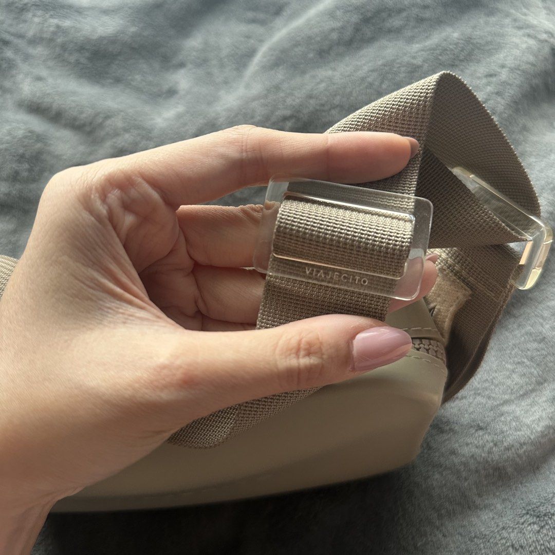 Viajecito Crossbody Bag Beige (Category: Cross-body Bags) located in Makati City. Submitted by riasanchez (Listing ID 1441861072, Image 2). Description: - Brand: Viajecito - Color: Beige - Type: Crossbody bag - Closure: Zip - Strap: Adjustable with clear buckle details - Design: Minimalist - Ideal for: Everyday use or travel - Condition: Shows some minor scuffs on the side.