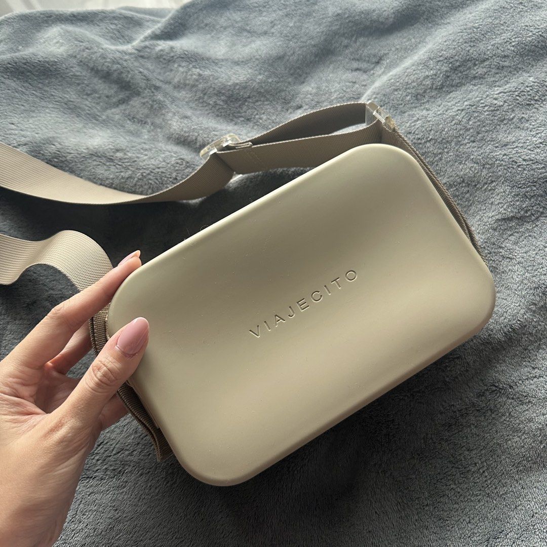 Viajecito Crossbody Bag Beige (Category: Cross-body Bags) located in Makati City. Submitted by riasanchez (Listing ID 1441861072, Image 1). Description: - Brand: Viajecito - Color: Beige - Type: Crossbody bag - Closure: Zip - Strap: Adjustable with clear buckle details - Design: Minimalist - Ideal for: Everyday use or travel - Condition: Shows some minor scuffs on the side.