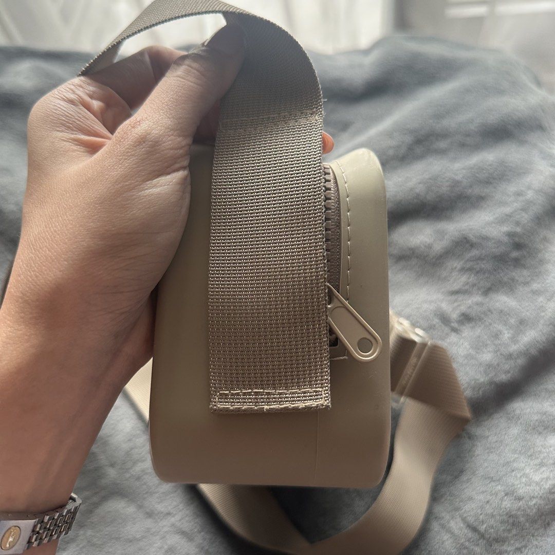 Viajecito Crossbody Bag Beige (Category: Cross-body Bags) located in Makati City. Submitted by riasanchez (Listing ID 1441861072, Image 3). Description: - Brand: Viajecito - Color: Beige - Type: Crossbody bag - Closure: Zip - Strap: Adjustable with clear buckle details - Design: Minimalist - Ideal for: Everyday use or travel - Condition: Shows some minor scuffs on the side.