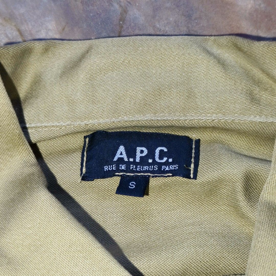 Vintage A.P.C. Rue de Fleurus Paris Jacket Size S (Category: Coats, Jackets and Outerwear) located in Ipil. Submitted by ajthriftfinds (Listing ID 1441880156, Image 2). Description: - W: 17 - L: 27.5 - A.P.C. jacket - Made in France - 100% Cotton - Two chest zip pockets - Two lower flap pockets - Button closure - Size S - Ideal for layering.