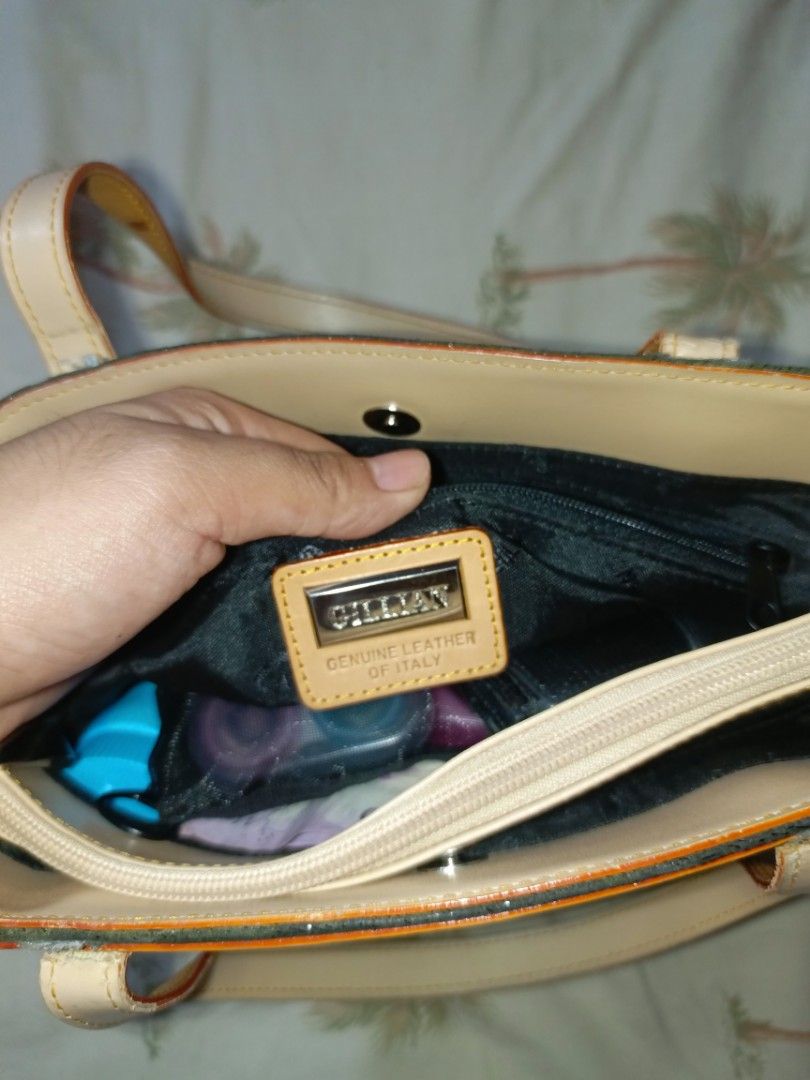 VINTAGE GILLIAN GENUINE LEATHER BAG (Category: Shoulder Bags) located in Rizal. Submitted by nokorimono. (Listing ID 1441787948, Image 2). Description: ⛓️ DETAILS & CONDITION: Aesthetic: Y2K Earthy Minimalist / Quiet Luxury / Dark Academia Hardware: Minimalist silver metal branding plate with smooth interior and exterior zippers. Exterior: Textured moss green fabric/leather body paired with high-quality tan genuine leather handles and trim. Inter