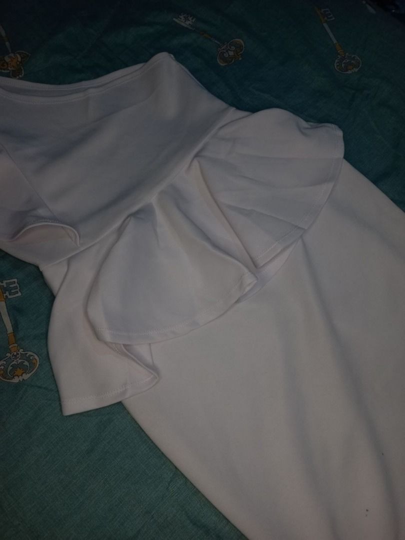 White One Shoulder Peplum Ruffle Dress (Category: Dresses) located in Marikina City. Submitted by gelandmeridor_015 (Listing ID 1441789533, Image 1). Description: - White one-shoulder dress - Features a peplum waist - Ruffle detail on the shoulder - Knee-length - Ideal for parties or nights out - Comfortable and stylish fabric - Can fit s-m.
