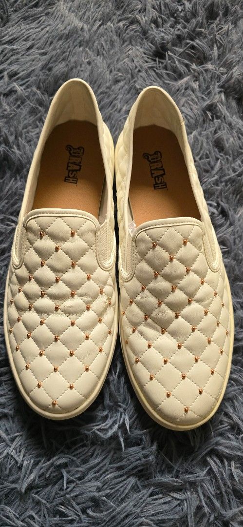 White Quilted Slip-On Shoes with Studs (Category: Sneakers) located in Marikina City. Submitted by jona.jah (Listing ID 1441830791, Image 2). Description: - Brand: Brash - Color: White - Style: Slip-on - Size: 9.5 - Design: Quilted with small stud details - Features: Easy to wear, perfect for everyday - technically brand new unworn pair - small flaw, please see last photo.