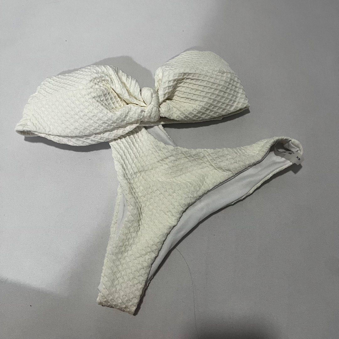 White Textured Bandeau Bikini Set XS (Category: Bikinis & Swimsuits) located in Manila. Submitted by 4ngeluh (Listing ID 1441951500, Image 1). Description: - White textured bikini set - Bandeau top with knot detail - High-cut bottoms - Size XS - Ideal for beach or pool days - Comfortable and stylish.