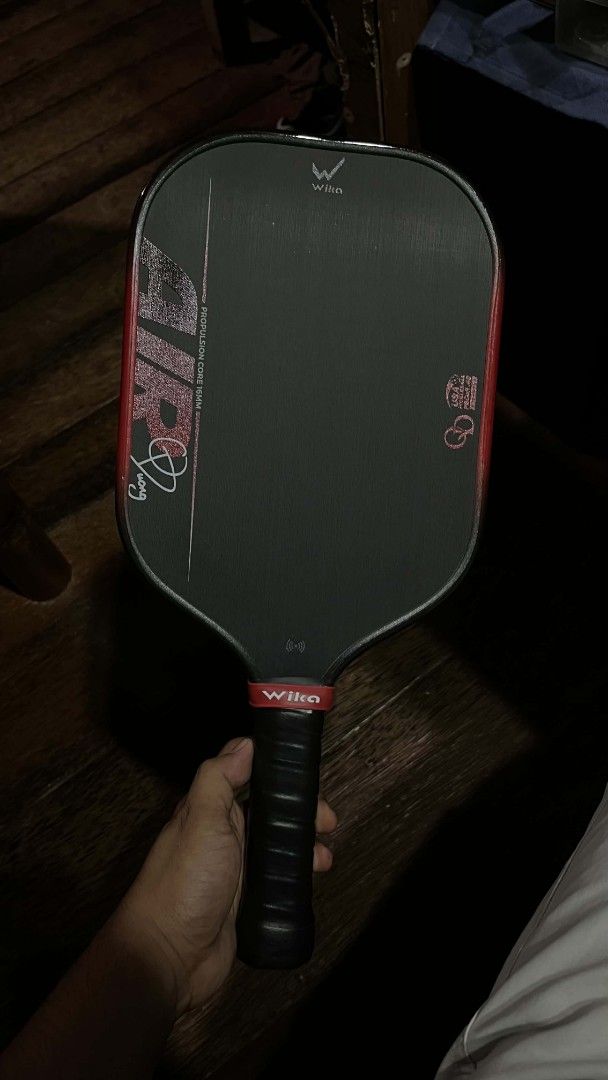 Wika Air Pickleball Paddle (Category: Racket and Ball Sports) located in Mati. Submitted by carlahrond12732 (Listing ID 1441937358, Image 1). Description: - Wika Air pickleball paddle - Color: red accents - Grip: Black - Condition: Excellent -3x lng nagamit - Feel free to ask any questions.