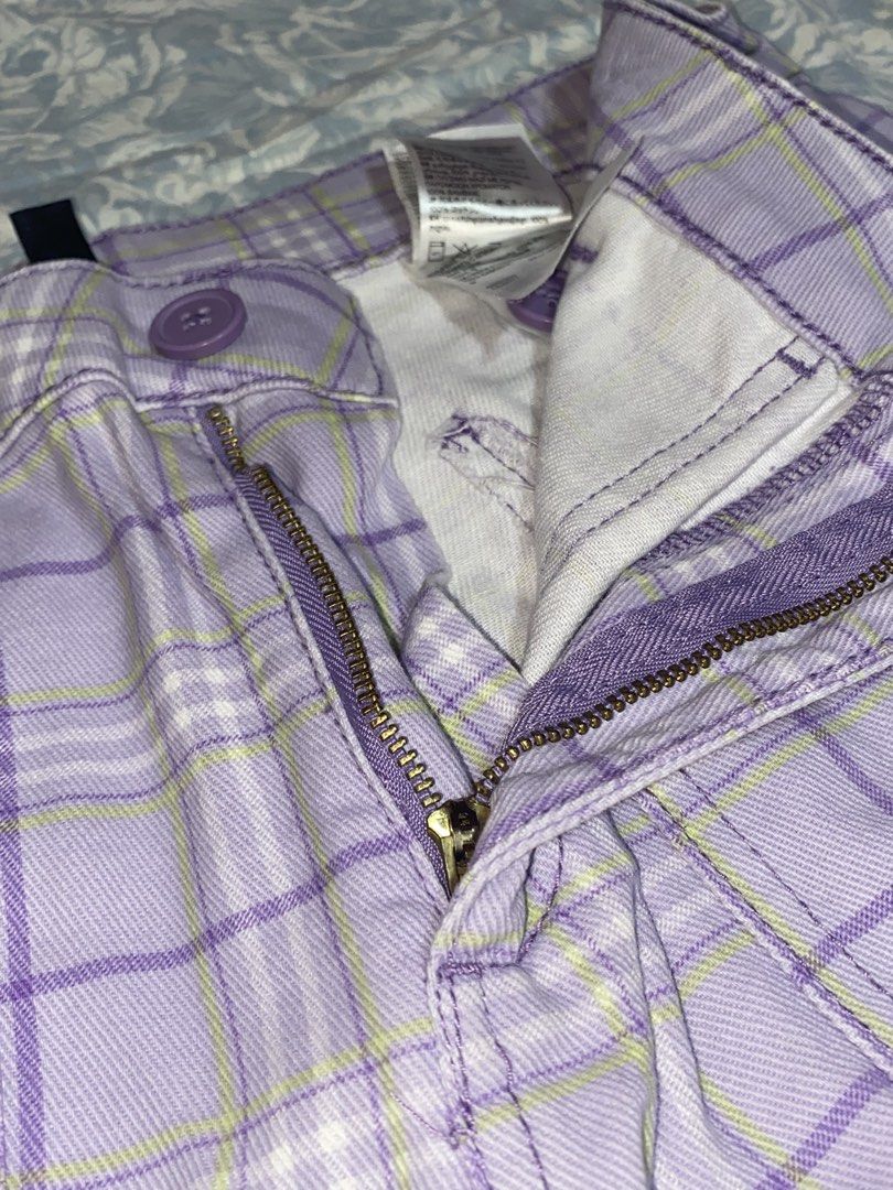 Wild Fable Purple Plaid Cargo Pants (Category: Other Bottoms) located in Caloocan City. Submitted by kaeroppi (Listing ID 1441874186, Image 3). Description: - Trendy purple plaid cargo pants - High-waisted design - Zipper and button closure - Two front pockets - Two functional cargo pockets on legs - Back pockets included - Flattering wide leg fit - Ideal for a stylish casual look.