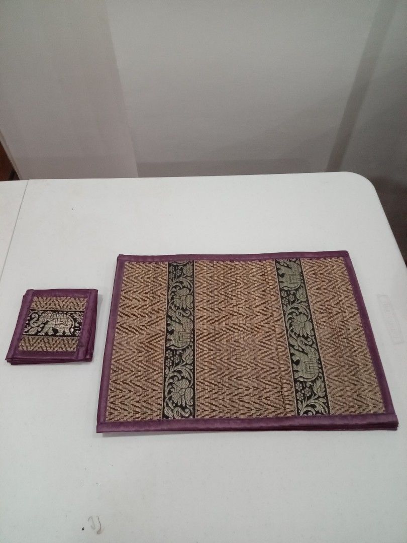 Woven Placemat and Coaster Set with Elephant Design (Category: Other Kitchenware & Tableware) located in Quezon City. Submitted by cloudcloset.ph (Listing ID 1441837911, Image 1). Description: - Set includes 6 woven placemats and 6 matching coasters. - Features a charming elephant and floral pattern. - Edges are beautifully trimmed with purple fabric. - Adds a decorative touch to your dining table. - Ideal for both special occasions and everyday 