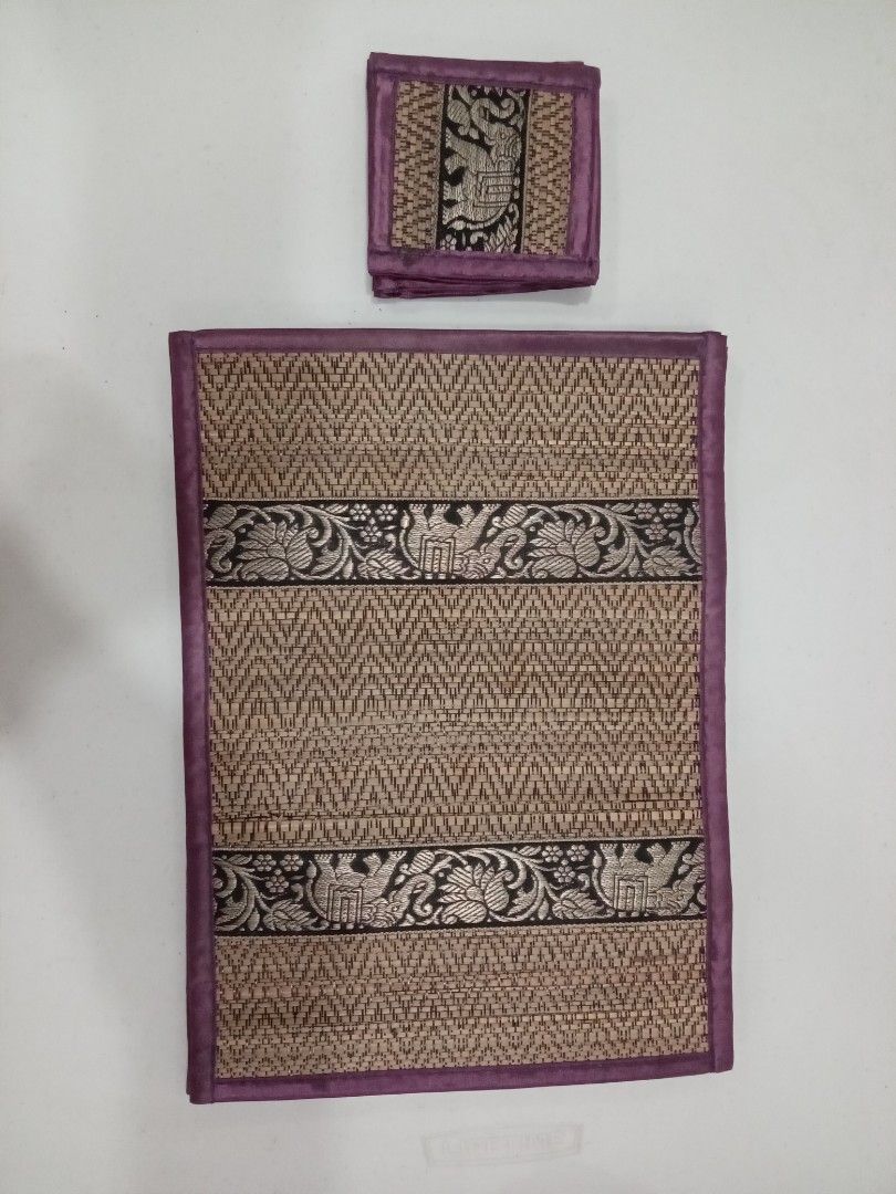 Woven Placemat and Coaster Set with Elephant Design (Category: Other Kitchenware & Tableware) located in Quezon City. Submitted by cloudcloset.ph (Listing ID 1441837911, Image 2). Description: - Set includes 6 woven placemats and 6 matching coasters. - Features a charming elephant and floral pattern. - Edges are beautifully trimmed with purple fabric. - Adds a decorative touch to your dining table. - Ideal for both special occasions and everyday 
