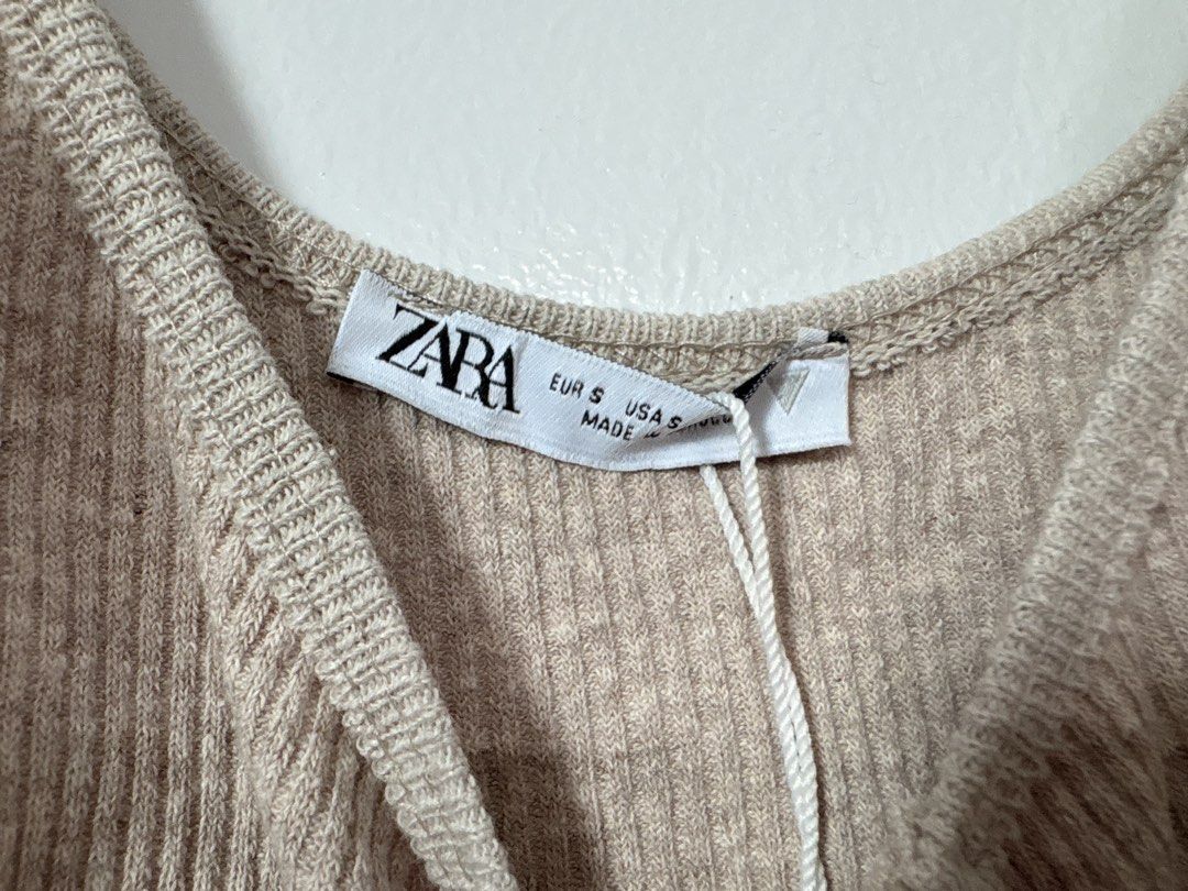Zara Rib-knit Bodysuit Top (Category: Sleeveless) located in Pasay City. Submitted by weartheclothes.mnl_shop (Listing ID 1441856866, Image 3). Description: Zara Body Suit 😍 Brandnew with tag May very small issue di halata and maybe removable pa, pls see last pic Small Lp posted.