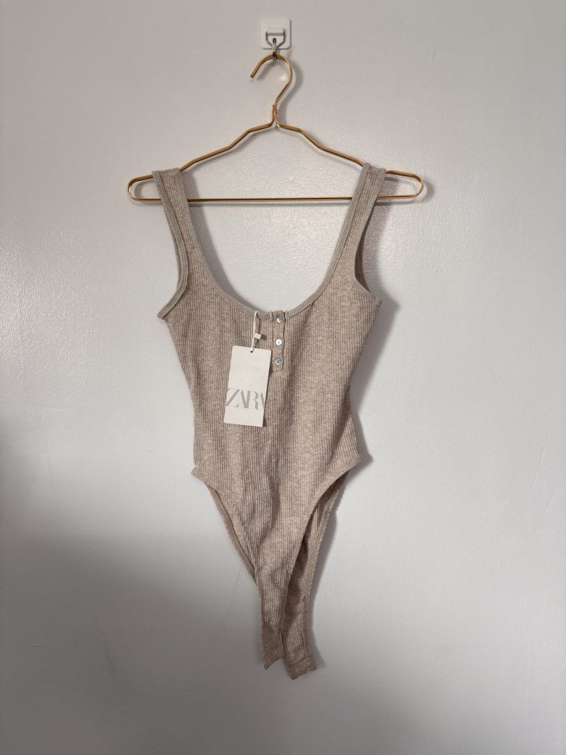 Zara Rib-knit Bodysuit Top (Category: Sleeveless) located in Pasay City. Submitted by weartheclothes.mnl_shop (Listing ID 1441856866, Image 2). Description: Zara Body Suit 😍 Brandnew with tag May very small issue di halata and maybe removable pa, pls see last pic Small Lp posted.