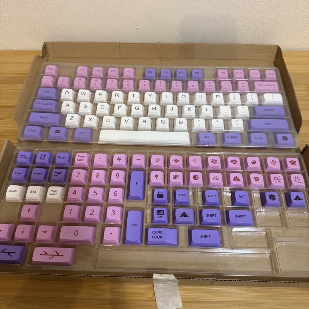 Keycap Full Kit - Pink Purple White (Category: Computer Keyboard) located in Bulacan. Submitted by declutter_diary02 (Listing ID 1441993536, Image 3). Description: - Full keycap set with 134 keys - XDA profile for a comfortable typing experience - Beautiful pink, purple, and white colorway - Includes keys for numpad and all essential function keys - Adorned with charming cherry blossom and floral designs on select keys - Compatible with most stan
