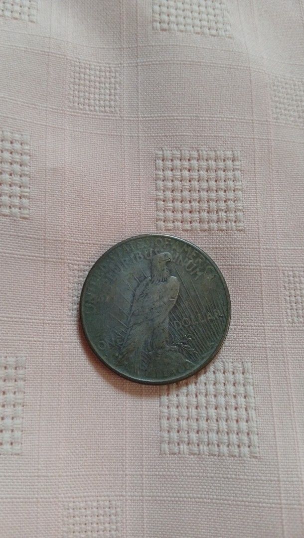 1927 Peace Silver Dollar Coin (Category: Currency) located in Quezon City. Submitted by jojoscollectibles (Listing ID 1441986418, Image 3). Description: - Authentic 1927 Peace Silver Dollar coin, Philadelphia mint - Features iconic Lady Liberty on the obverse - Showcases a majestic eagle on the reverse - A classic and sought-after American silver dollar - Ideal addition to any coin collection - Feel free to ask any questions!.