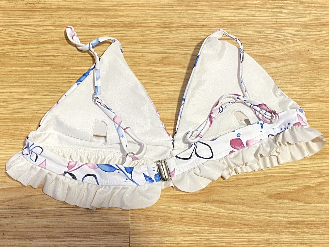 3 Bikini Tops - Floral & Blue Ribbed (Category: Bikinis & Swimsuits) located in Quezon City. Submitted by terrysattic (Listing ID 1442100465, Image 3). Description: - White bikini top with pink & blue floral print and ruffled edges. - Light blue ribbed triangle bikini top. - Blue with cream lining - All tops feature adjustable straps for a perfect fit. - Secure clasp closures. - Ideal for beach or pool days. - Mix and match these versatile styles