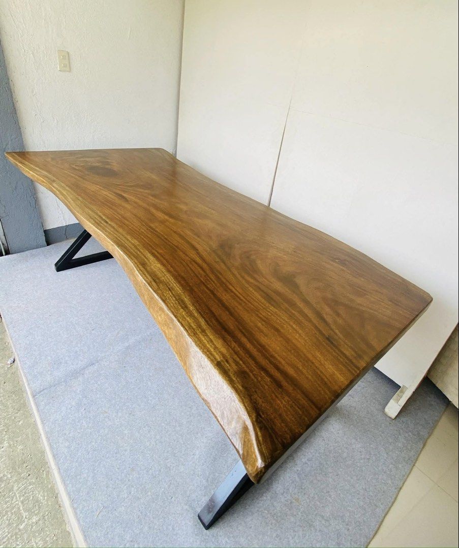 6-8 Seaters Acacia Wood Dining Table (Category: Tables & Sets) located in Manila. Submitted by elliefurnies31 (Listing ID 1442129067, Image 3). Description: ONHAND BRAND NEW 6-8 SEATER ACACIA WOOD DINING TABLE WHOLE SLAB TUBULAR LEGS SIZE: 84L" x 41.5-34.5-35W" x 31.5H" inches ( AS-IS ITEM ) IN GOOD CONDITION.