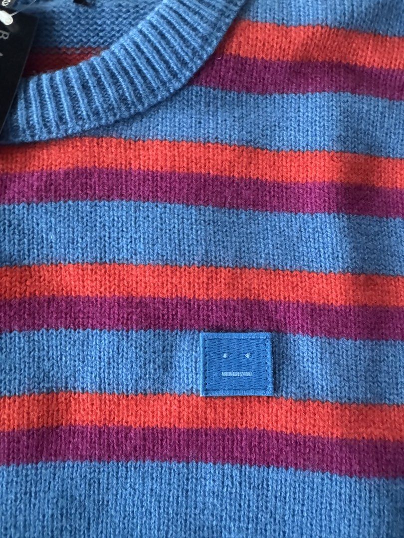 Acne Studios Striped Sweater - Blue, Red, Purple (Category: Longsleeves) located in Binan City. Submitted by marie.alz (Listing ID 1442030277, Image 2). Description: - Acne Studios sweater - Features blue, red, and purple stripes - Signature face logo patch on chest - Crew neck, long sleeves -with original tags attached - Purchased from Barneys New York - Excellent quality knitwear - No to low baller (will keep it instead if not sold) .