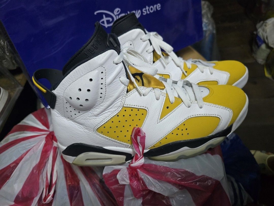 Air Jordan 6 "DMP" Yellow Black White (Category: Sneakers) located in Manila. Submitted by andrew15o (Listing ID 1442020606, Image 2). Description: - Classic Air Jordan 6 silhouette - Striking yellow, black, and white colorway - Features the iconic Jumpman logo on the sole - Shows minor scuffs on the toe box and sole - Still has significant life and wear remaining - Was not used for Basketball Plays..