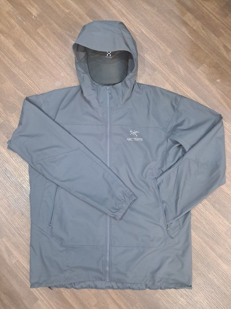 Arc'teryx Nodin Hooded Windbreaker Jacket (Category: Coats, Jackets and Outerwear) located in Baguio. Submitted by floss31172840 (Listing ID 1442117818, Image 2). Description: - Grey Arc'teryx hooded jacket - Lightweight and packable design - Full zip front with convenient pockets - Elasticated cuffs and hem for a snug fit - Perfect for outdoor adventures or casual everyday wear.