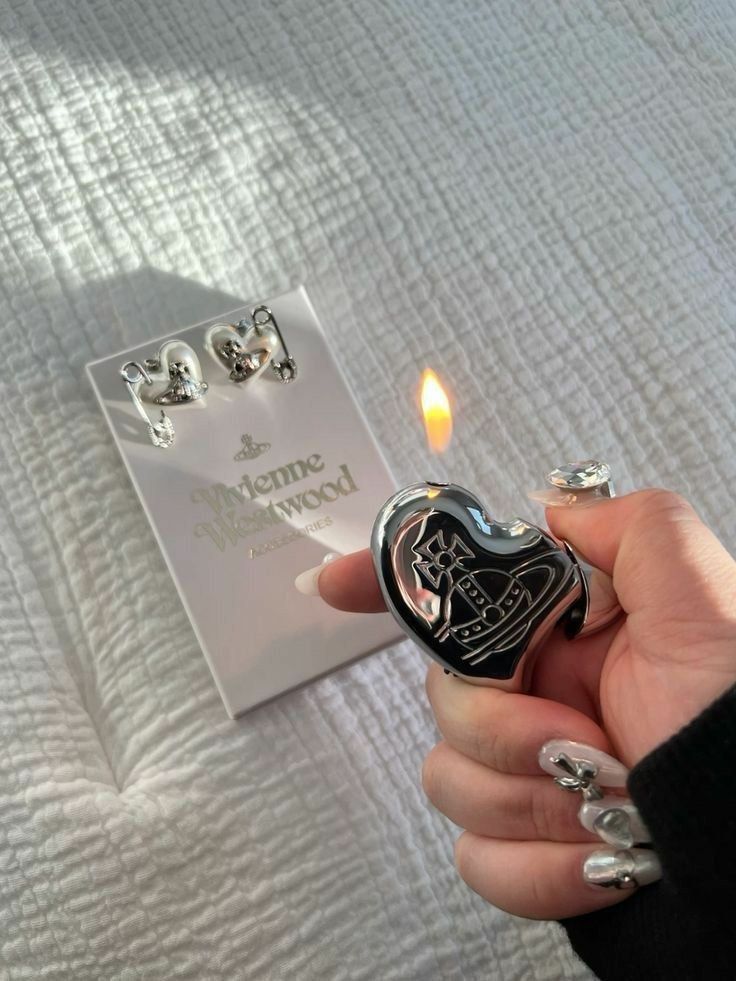 Authentic Vivienne Westwood Heart Lighter ✨ (Category: Luxury Accessories) located in Manila. Submitted by designerarchives.ph (Listing ID 1442151699, Image 1). Description: Colors: Silver, Black, Pink, Red ₱8500 •Limited edition: Pink & Red 💗♥️ Also available: Cigarette Case & Ashtray 🇯🇵 - 7 to 10 days ETA - 50% dp is required to order and ship in Ph - Buyer will shoulder local shipping - No return or exchange.