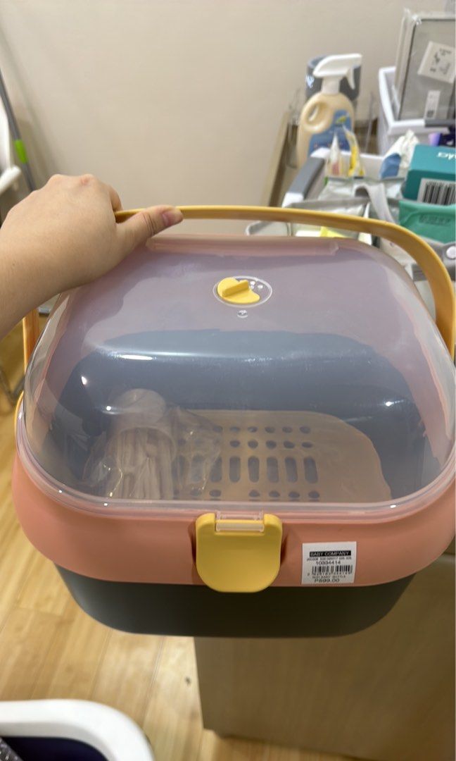 Baby Bottle Dish Drying Rack with Cover (Category: Breastfeeding & Bottle Feeding) located in Dasmarinas. Submitted by denmae (Listing ID 1442073878, Image 1). Description: - Keep baby bottles and utensils dust-free with this cute pink and grey drying rack. - Features a secure yellow latch to keep the lid closed. - Easy to carry to the convenient yellow handle. - Ideal for drying baby bottles and other kitchen essentials..