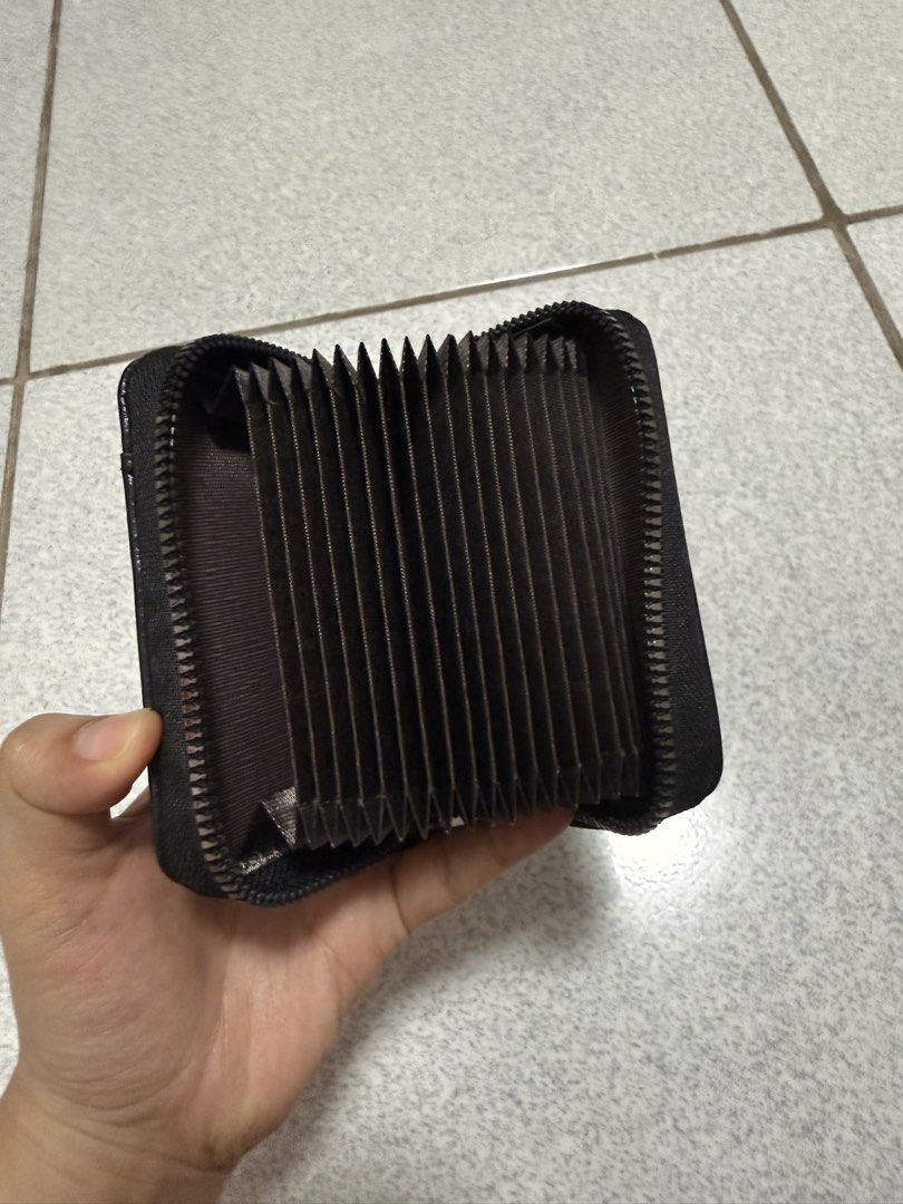 Unbranded Black Leather Zipper Card Holder (Category: Wallets & Card Holders) located in San Jose del Monte. Submitted by hellocutease (Listing ID 1442113519, Image 2). Description: RFS: one of owner's (my brother) impulse buys - wallets/card holders/passport holder - Compact black wallet - Secure zipper closure - Multiple card slots for organization - Small red, white, and blue stripe detail on the front - Pocket-friendly and bag-friendly design