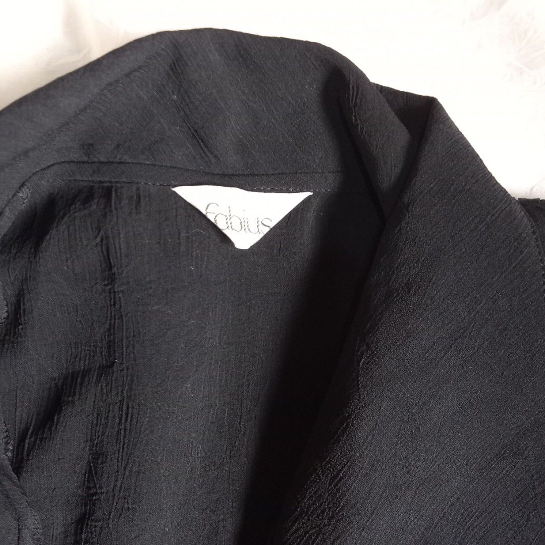 Black Pleated Short Sleeve Button-Up Blouse (Small) (Category: Blouses) located in Talisay. Submitted by peonisces (Listing ID 1442116564, Image 3). Description: - Black short sleeve blouse - Pleated texture on front and sleeves - Two button front closure - Collar neckline - Lightweight fabric - Perfect with skirts or pants.