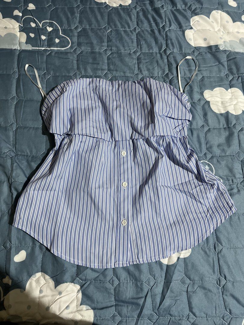 Blue and White Striped Off-Shoulder Ruffle Top (Category: Blouses) located in Manila. Submitted by az0r_ (Listing ID 1442112258, Image 2). Description: - Cute blue and white striped design - Tube style - Button-down front - Ideal for casual wear or beach trips - Versatile: pairs easily with shorts or jeans.