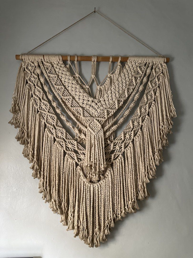 Boho Macrame Wall Hanging Tapestry (Category: Wall Decor) located in Manila. Submitted by grasya008 (Listing ID 1441988450, Image 1). Description: Boho macrame wall hanging made with natural cotton rope and a wooden dowel. Adds a unique textured vibe to your living room, bedroom, or nursery. Malaki sya :) Need lang labhan price is negotiable.