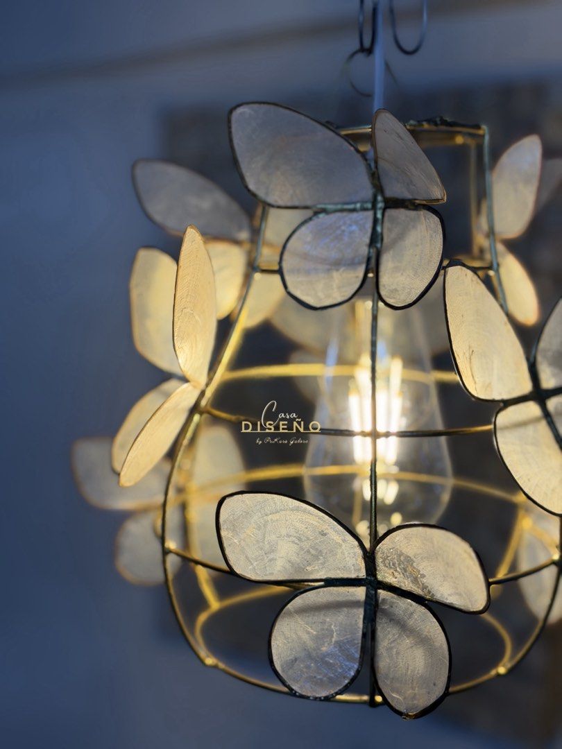 Butterfly Capiz Shell Pendant Light (Category: Lighting) located in Caloocan City. Submitted by casadisenyo (Listing ID 1442009847, Image 3). Description: - Whimsical cage pendant light - Delicate capiz shell butterfly accents - Brass finish metal frame - Includes light bulb - Ideal for nurseries and bedrooms AVAILABLE ON HAND.