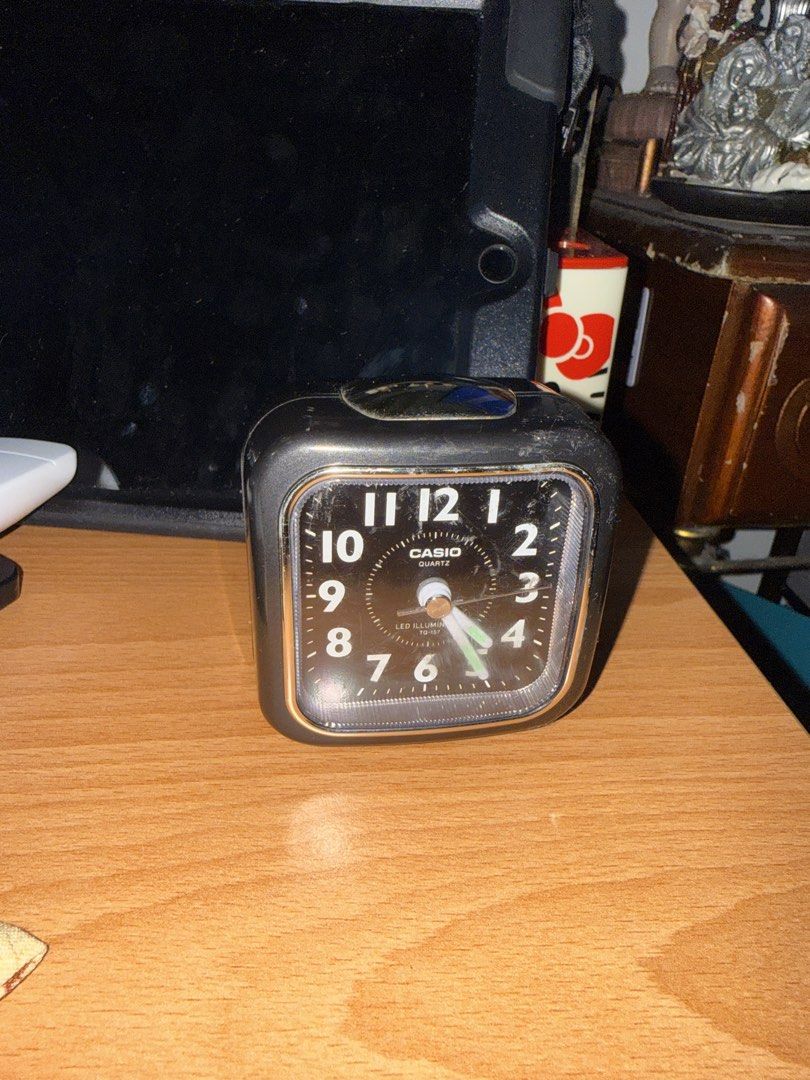 Casio Quartz Alarm Clock LED Illumination (Category: Clocks) located in Manila. Submitted by eicho (Listing ID 1442088338, Image 3). Description: - Classic black Casio alarm clock - Square face with easy-to-read clear numbers - Built-in LED illumination for nighttime viewing - Simple on/off switch and alarm setting dial on the back - Fully functional and works well - Minor cosmetic scratches on the casing.