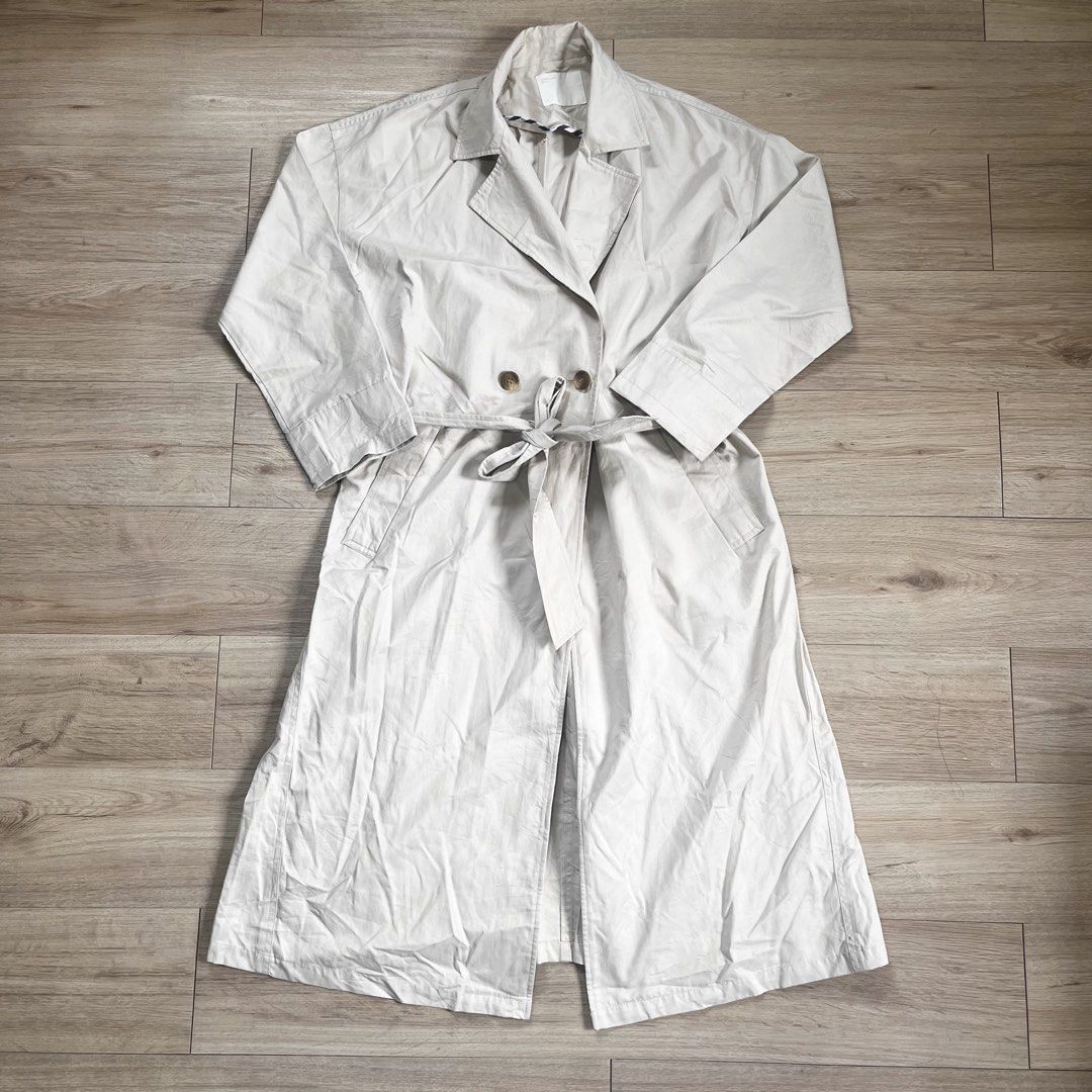 Classic Beige Trench Coat with Belt (Category: Coats, Jackets and Outerwear) located in Legazpi City. Submitted by hushedcry (Listing ID 1442013104, Image 3). Description: - Classic beige trench coat - Double-breasted design - Includes a tie belt - Can be worn open or closed - Perfect for layering over any outfit - Timeless and easy to style - needs ironing 💌 mop: gcash / maya accepted 📬 shipping via j&t express (sf c/o buyer) for inquiries, do