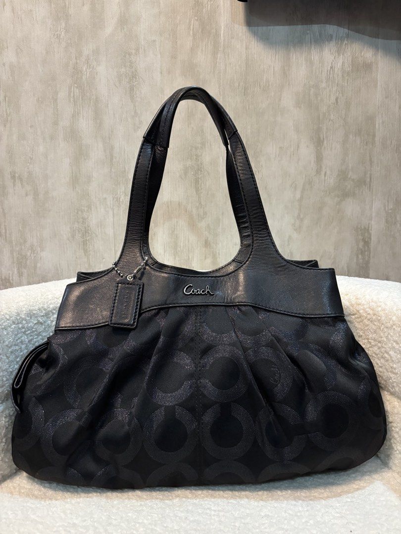 Coach Black Signature Monogram Shoulder Bag (Category: Luxury Bags & Wallets) located in Manila. Submitted by _thepursela (Listing ID 1442022755, Image 1). Description: - Authentic black Coach shoulder bag - Features iconic all-over C monogram pattern - Genuine leather trim and handles - Secure top zipper closure - Spacious interior, ideal for daily essentials - Timeless and versatile Coach design.