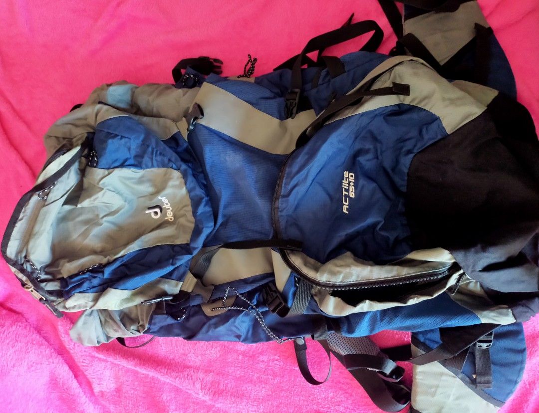 Deuter ACT Lite 65+10 Backpack (Category: Backpacks) located in Las Pinas. Submitted by bellajoy1 (Listing ID 1442090602, Image 2). Description: - Deuter ACT Lite 50+10 backpack - Color: Blue and Grey - Ideal for hiking and travel - Features multiple straps and pockets for organized storage - Adjustable straps for a comfortable, customized fit - Shows some signs of wear but remains in good, functional condition.