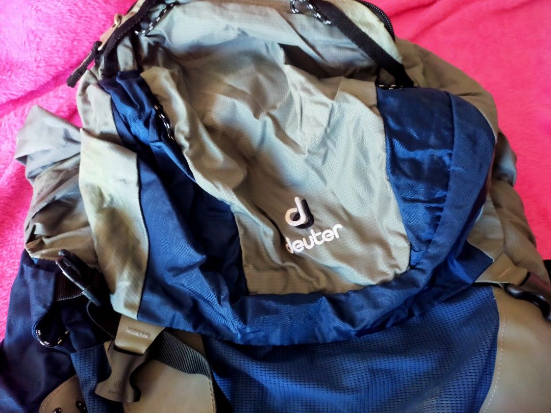 Deuter ACT Lite 65+10 Backpack (Category: Backpacks) located in Las Pinas. Submitted by bellajoy1 (Listing ID 1442090602, Image 3). Description: - Deuter ACT Lite 50+10 backpack - Color: Blue and Grey - Ideal for hiking and travel - Features multiple straps and pockets for organized storage - Adjustable straps for a comfortable, customized fit - Shows some signs of wear but remains in good, functional condition.