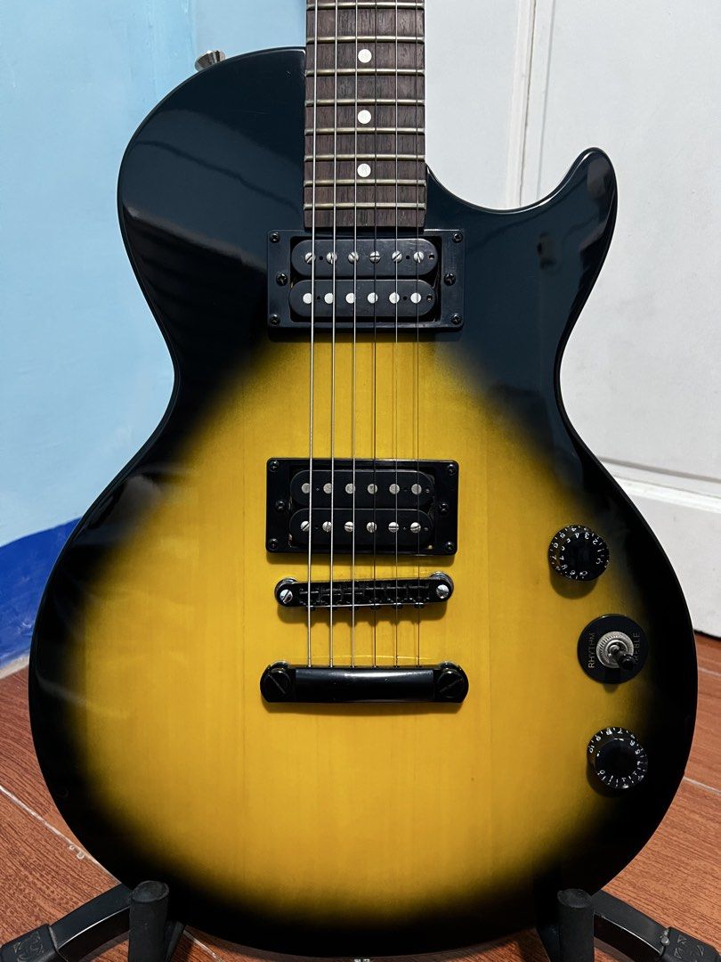 Epiphone Les Paul Special-II with Stand (Category: Musical Instruments) located in Valenzuela. Submitted by abajabajabaja (Listing ID 1442135809, Image 2). Description: ‼️FOR SALE‼️ Epiphone Les Paul Special II Color : Vintage Sunburst FREE Hercules Guitar Stand USED and has a slight issue (5 & 6 Picture) (Message for more Pictures or Videos) RFS : Pabenta lang ng Uncle ko (I have no idea sa guitar, PLEASE RESPECT!) 💸₱6,999💸 (Slight Negotiable)
