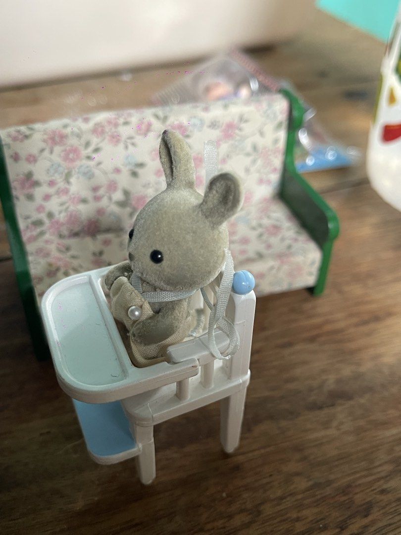 Epoch Sylvanian Families Bunny Baby High Chair & Sofa (Category: Kids Tables & Chairs) located in Muntinlupa City. Submitted by wgesez5uji (Listing ID 1442114585, Image 2). Description: - Sylvanian Families bunny baby set - Includes white and blue high chair - Features a cute bunny wearing a bib - Comes with a small floral sofa - Ideal for imaginative pretend play - Made by Epoch Co., Ltd..