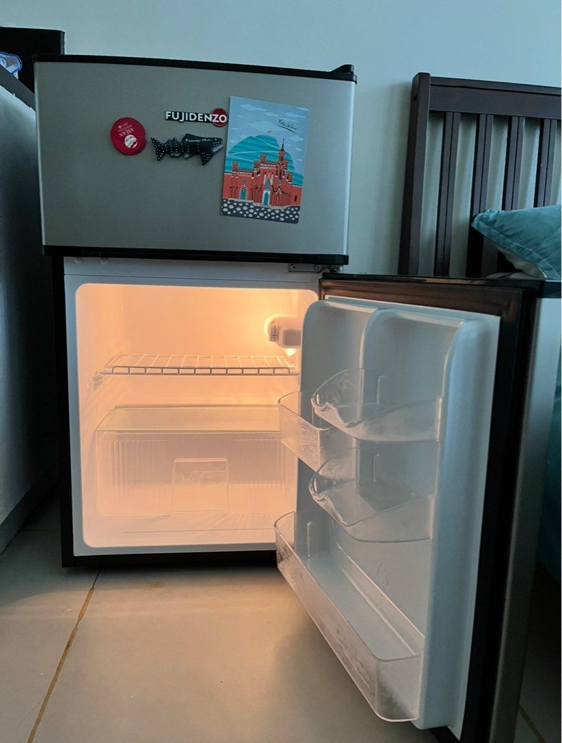 Fujidenzo Mini Fridge (Category: Refrigerators and Freezers) located in Pasig City. Submitted by dianexing (Listing ID 1442142602, Image 2). Description: - Compact Fujidenzo mini fridge - Works well and keeps items cool - Features a small freezer compartment at the top - Perfect for dorm rooms or small spaces - Door shelves ideal for storing drinks - Includes original power cord - Ready for its new home.