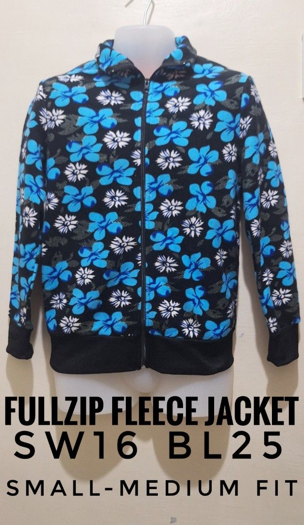 Fullzip Fleece Jacket SW16 BL25 Small-Medium Fit (Category: Coats, Jackets and Outerwear) located in Los Banos. Submitted by mckecollection (Listing ID 1442054407, Image 1). Description: - Black fleece jacket with a cool blue and white floral print. - Full zip closure for easy wear. - Ribbed cuffs and hem for a snug fit. - Lined with bright yellow fleece for ultimate warmth. - Fits like a Small to Medium. - Ideal for cooler weather and staying co