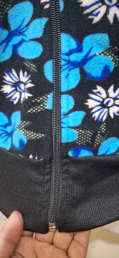 Fullzip Fleece Jacket SW16 BL25 Small-Medium Fit (Category: Coats, Jackets and Outerwear) located in Los Banos. Submitted by mckecollection (Listing ID 1442054407, Image 3). Description: - Black fleece jacket with a cool blue and white floral print. - Full zip closure for easy wear. - Ribbed cuffs and hem for a snug fit. - Lined with bright yellow fleece for ultimate warmth. - Fits like a Small to Medium. - Ideal for cooler weather and staying co