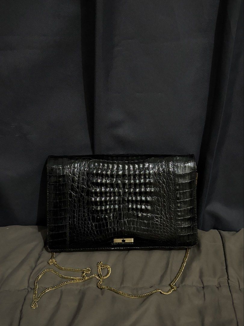 Genuine Crocodile Flap Bag (Category: Luxury Bags & Wallets) located in Munoz. Submitted by lolongs (Listing ID 1442117010, Image 1). Description: - Genuine crocodile crocskin - Exotic skin / Animal skin - Sobrang ganda nito sa personal. Lakas makaChanel - Gold na gold pa ang chain and hardware - Pwedeng alisin ang chain and gawing clutch lang .