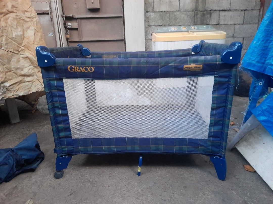 Graco Playpen Portable Crib (Category: Cots & Cribs) located in Valenzuela. Submitted by newbear.425b6e (Listing ID 1441999331, Image 1). Description: - Graco portable playpen - Blue and green plaid design - Mesh sides for visibility - Includes blue mattress pad - Easy to set up and take down - Perfect for travel or home use -Japan surplus .