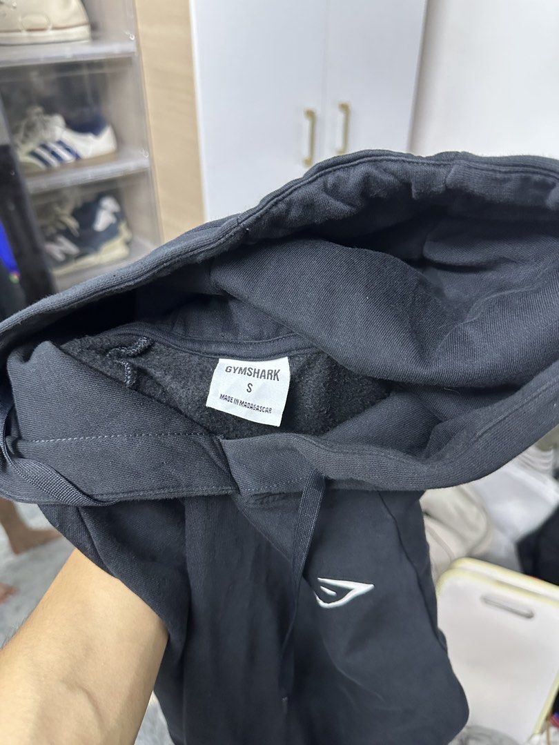Gymshark Black Hoodie Size S (Category: Hoodies) located in Manila. Submitted by frederick0007 (Listing ID 1442093063, Image 3). Description: - Black Gymshark hoodie - Gymshark logo on chest - Made in Madagascar - Size S - Ideal for workouts or casual wear Size small on tag but also fits to XS.