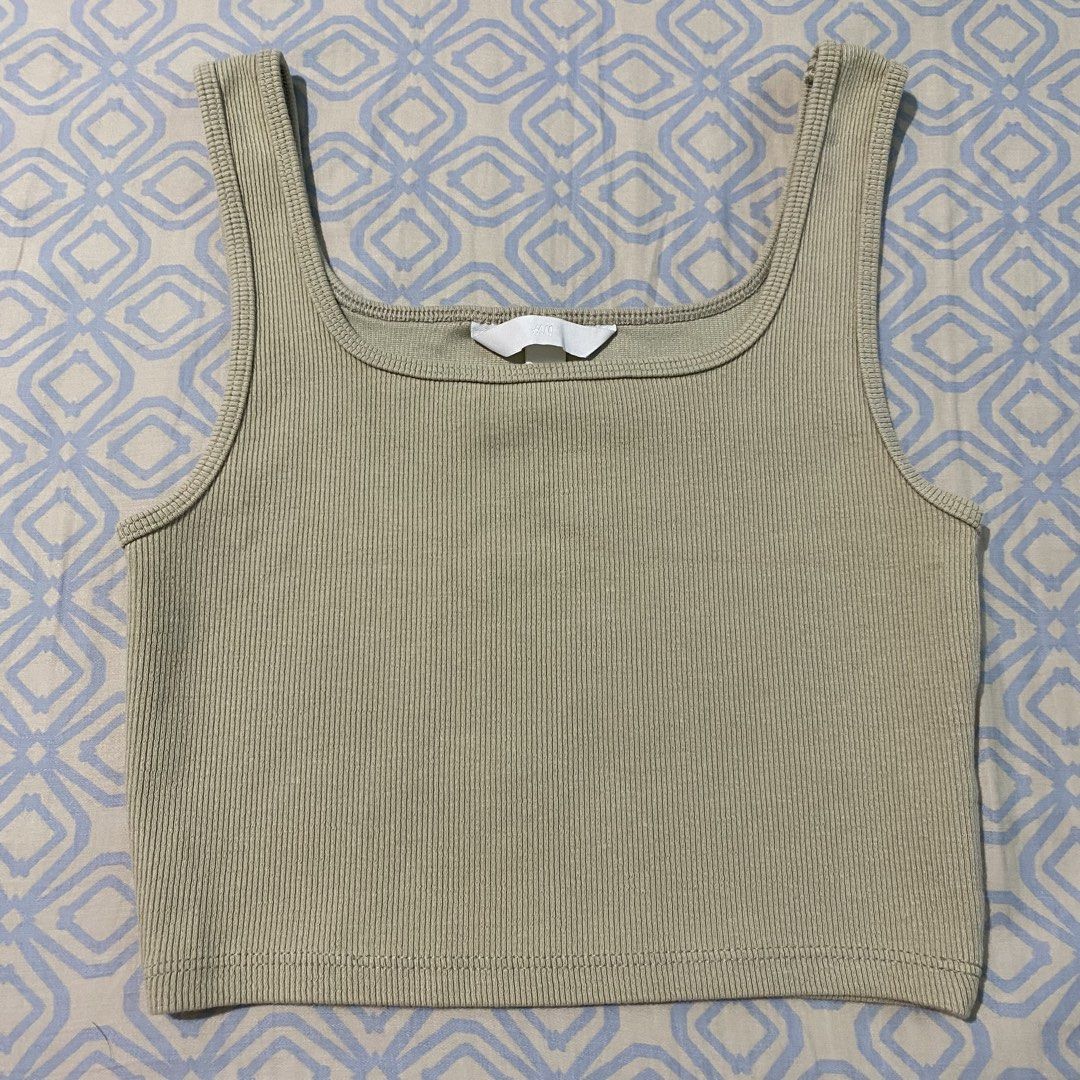 H&M Ribbed Square Neck Cropped Tank Top (Category: Sleeveless) located in Quezon City. Submitted by ndrmkl (Listing ID 1442062038, Image 2). Description: - Very unique light khaki green color - High quality ribbed material - Flattering square neckline and cropped length - Perfect for layering or wearing solo - SOLD OUT IN-STORE AND ONLINE - Go-to basic and comfy airport fit H&M zara bershka pull&bear mango basics tank tee top vest airport lounge 