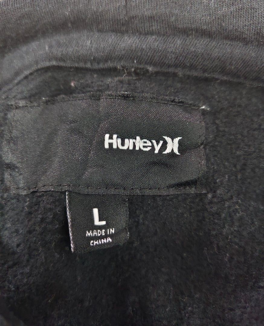 Hurley Black Hoodie Size L (Category: Hoodies) located in Cavite. Submitted by whew12 (Listing ID 1442009283, Image 3). Description: - Black Hurley hoodie - Size L - Large Hurley logo on chest - Smaller logos on sleeves - Front pocket - Hooded design - Cotton-polyester blend fabric - Ideal for casual wear.