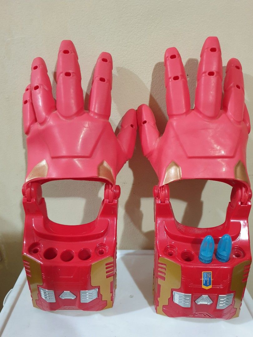 Iron Man Repulsor Ray Gauntlet Toy Gloves (Category: Action & Battle Toys) located in Las Pinas. Submitted by anggesmart (Listing ID 1441989526, Image 1). Description: - Preloved Iron Man Repulsor Ray Gauntlet Toy Gloves - Classic Red, Gold, and Blue color scheme - Features articulated fingers for realistic play - Note: Small crack on the palm of one glove. - Ideal for costumes, dress-up, or imaginative play.