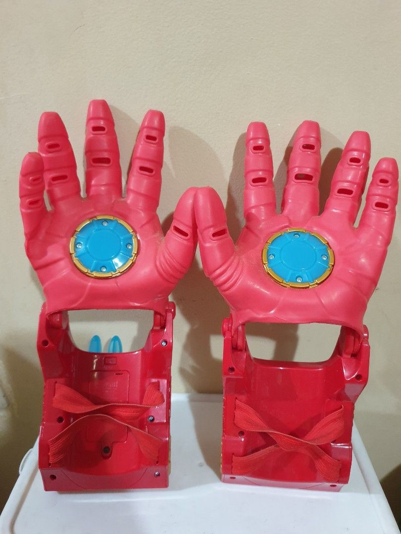 Iron Man Repulsor Ray Gauntlet Toy Gloves (Category: Action & Battle Toys) located in Las Pinas. Submitted by anggesmart (Listing ID 1441989526, Image 2). Description: - Preloved Iron Man Repulsor Ray Gauntlet Toy Gloves - Classic Red, Gold, and Blue color scheme - Features articulated fingers for realistic play - Note: Small crack on the palm of one glove. - Ideal for costumes, dress-up, or imaginative play.