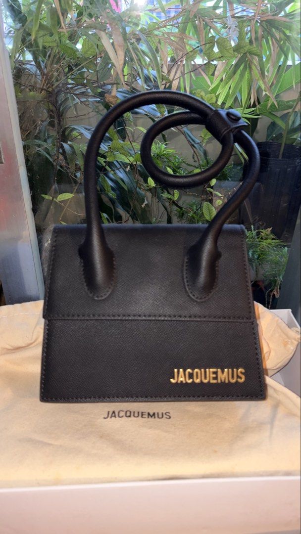 Jacquemus Le Chiquito Noeud (Black) (Category: Luxury Bags & Wallets) located in Manila. Submitted by jocelynsnight (Listing ID 1442072335, Image 3). Description: 🖤 Jacquemus Le Chiquito Noeud (Black) Selling my aunt’s beautiful Jacquemus Le Chiquito Noeud in classic black! Super versatile bag with the signature twistable/loop top handle. Looks small but easily fits your cards, keys, and favorite lipstick! 💄✨ Condition: 9/10 Gently used only ab