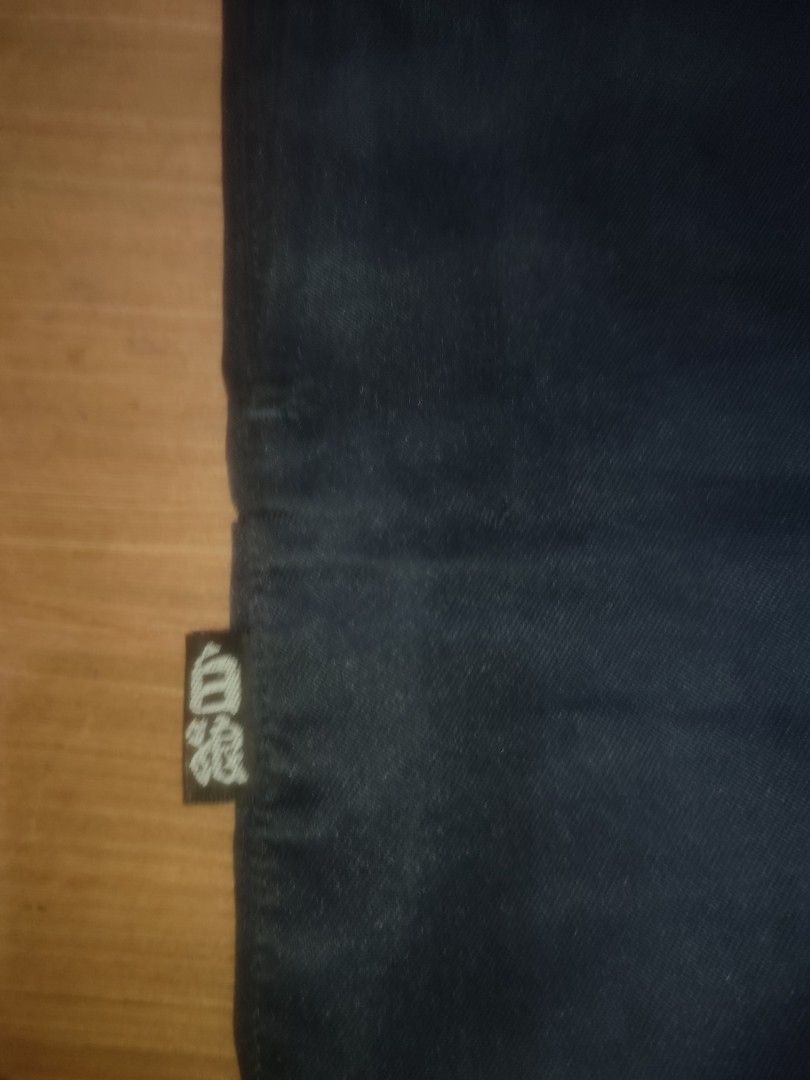 Japanese Construction Worker Pants with Paints stains (Category: Other Bottoms) located in Baybay. Submitted by thriftits00 (Listing ID 1442128711, Image 3). Description: - Black pants - White label on the side with writing - Tie details at the bottom.