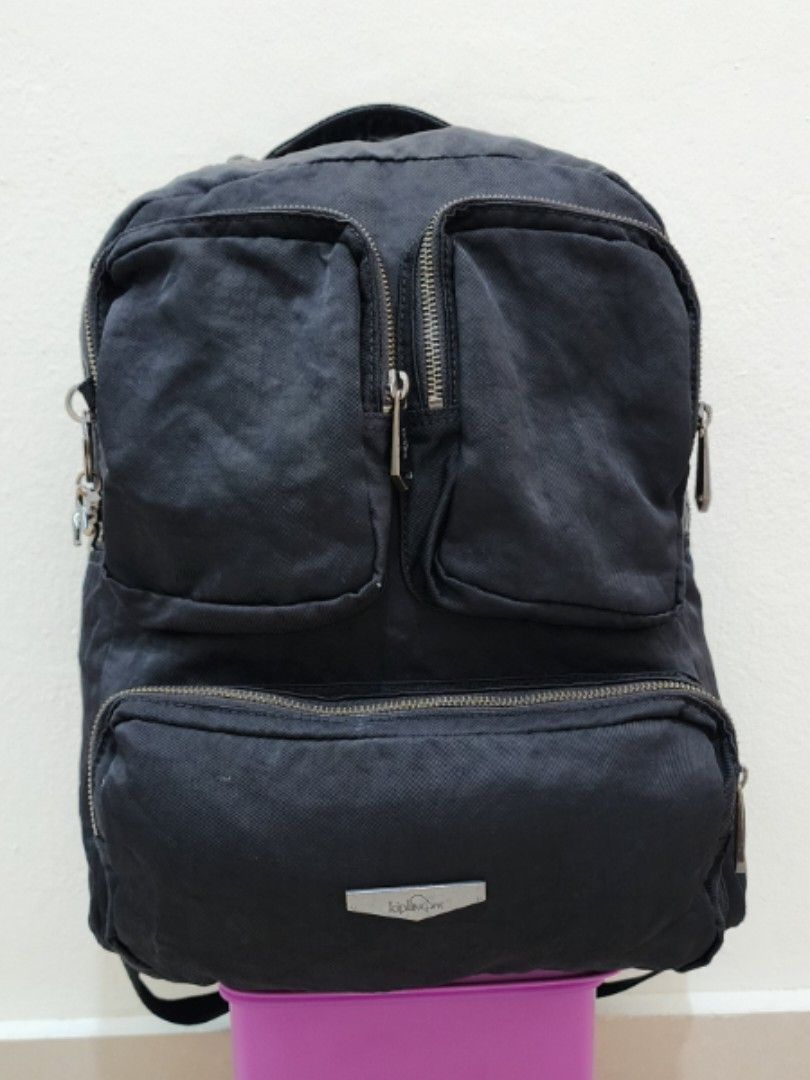 Kipling Backpack (Category: Backpacks) located in Sepang. Submitted by alee73 (Listing ID 1442072717, Image 1). Description: - Classic Kipling backpack - Multiple front zip pockets for easy access - Padded shoulder straps for comfortable carrying - Spacious interior, likely fits a laptop - Perfect for school, work, or everyday adventures - Zippers are in good working condition - Condition 9/10.